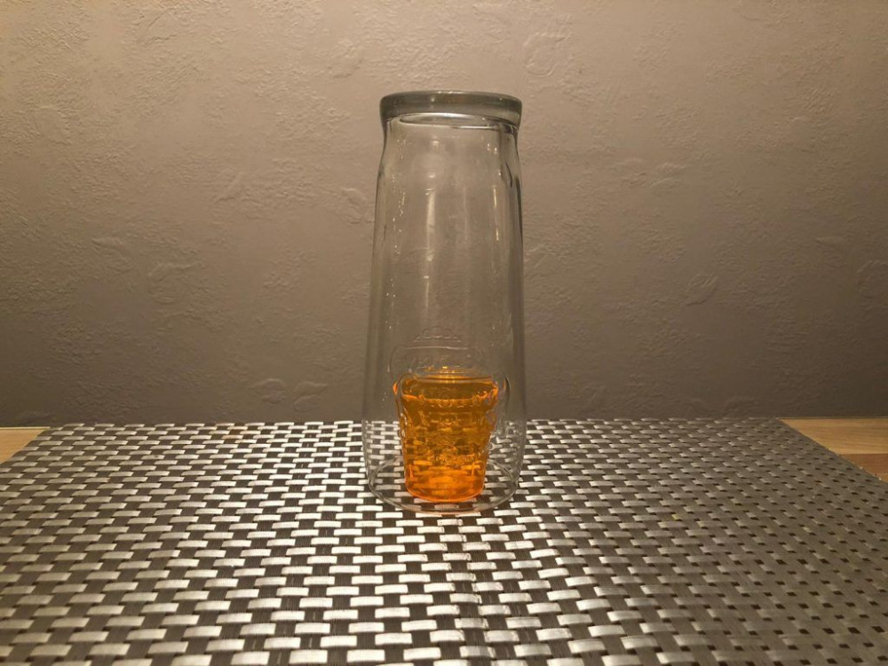 Shot glass covered by pint glass